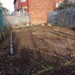 Rear view of vacant 187 sqm freehold land on Ladybarn Lane, Fallowfield, Manchester - ideal development site near amenities