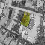Secure wooden gated entrance to 1,453 sq ft residential land for sale in Stockport SK3, ideal for single-storey home development