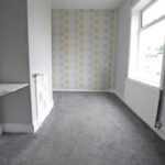 Large rear garden and carport at two-bedroom semi-detached house, Bedford Street Elland, with planning permission for detached dwelling