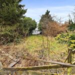 Vacant development site adjacent to 101 Shroggs Road, Halifax, with full planning for modern 3-bedroom detached home and rear lane access