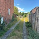 Expansive vacant plot behind 14 Station Road in Lostock Gralam with approved planning for detached house