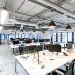 Modern 4th floor office in Grade II* Battleship Building, 179 Harrow Road W2, featuring wrap-around windows and abundant daylight near Paddington