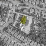 Wooden gates and fencing enclosing prime 1,453 sq ft development land in Stockport SK3