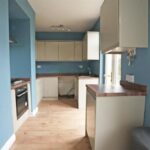 Large rear garden with carport at 2-bed semi-detached house on Bedford Street, Elland, featuring outline planning for detached dwelling