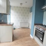 Large rear garden and carport of two-bedroom semi-detached house in Elland with outline planning for detached dwelling