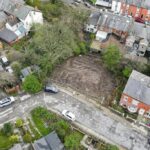 Vacant residential plot on Leopold Road in Blackburn with planning permission for two semi-detached three-bedroom houses near Corporation Park