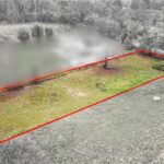Secluded grassland plot for sale on Vineyards Road, Northaw, Potters Bar, screened by mature trees for privacy near M25 and rail links