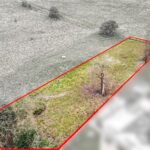 Mature trees screening secluded grassland plot for residential development on Vineyards Road, Northaw, Potters Bar, Hertfordshire EN6