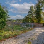 Vacant 11,928 sq ft site in Purley CR8 with full planning for two semi-detached and one detached 3-bed house, off-road parking, south-facing gardens