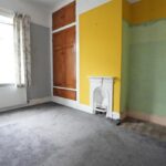 Large rear garden and carport at Bedford Street semi-detached house in Elland, ideal for new detached dwelling with outline planning permission