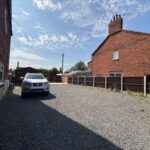 Serene canal side development land in Booth Lane, Middlewich, with outline planning for two semi-detached houses, ideal investment opportunity.