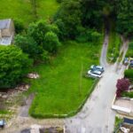 0.25-acre building land on Astley Street, Darwen, surrounded by cottages and lush woodland, with planning for luxury 3-bed home