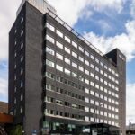Iconic Metro Building facade opposite Hammersmith Broadway, W6 - versatile 105k sq ft office investment with redevelopment potential