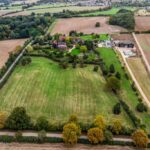 Expansive 1.2-acre south-facing pasture paddocks in gated Theobalds Park Estate, Goffs Oak, offering stunning London skyline vistas
