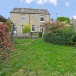 Front view of two-bedroom semi-detached investment property on Bedford Street, Elland, with carport and development potential