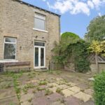Large rear garden and carport in two-bedroom semi-detached house on Bedford Street, Elland, with outline planning permission for detached dwelling