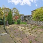 Large rear garden and carport at two-bedroom semi-detached house in Elland with outline planning for detached dwelling